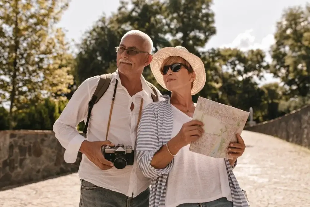Elderly couple reviewing international Best Travel Insurance for Seniors Over 65 in Michigan documents