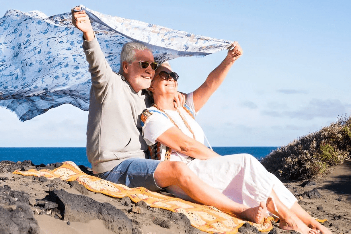 Senior couple participating in Traverse City Cherry Festival, exemplifying travel tips for Medicare beneficiaries in Michigan to enjoy local events safely.